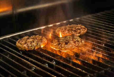 Cooking the beef patty for the Supreme Nacho Burger at Slater's 50/50 in Liberty Station San Diego.