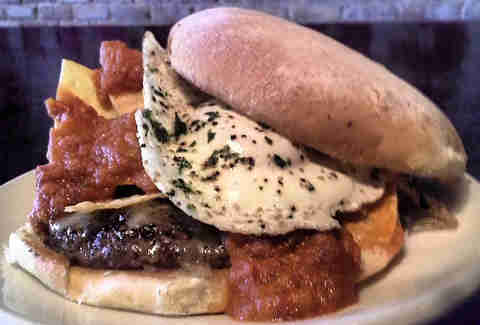 Huevos Rancheros burger at DMK in Lakeview