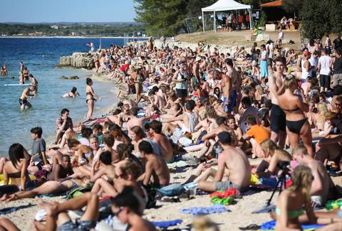 people haning out on the beach