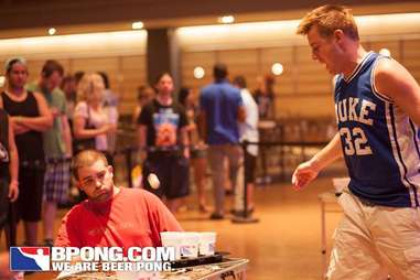 guy throwing in beer pong