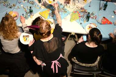 Sophia serving people at her supper club in Berlin