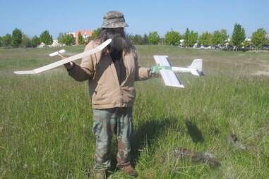 Dude holding airplanes