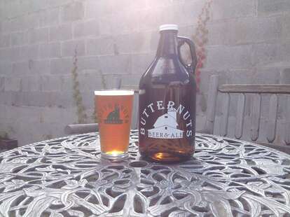 Butternuts growler and pint of beer