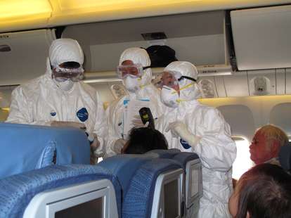 HAZMAT team on an airplane