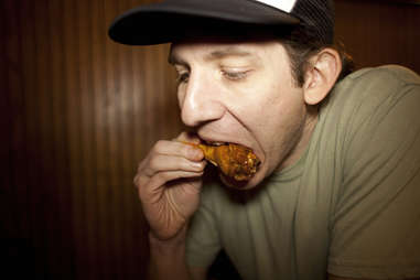 Matt Reynolds eating a wing