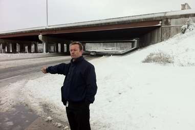 man hitching in the snow