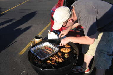 Man barbecuing at tailgate