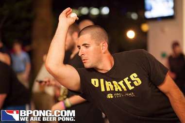 guy playing beer pong