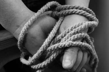 hands bound in rope