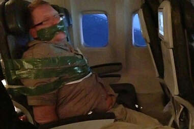 Dude duct taped on plane