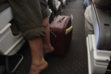 Dude on plane without shoes