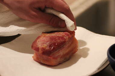 patting pork dry