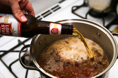 pouring beer in chili
