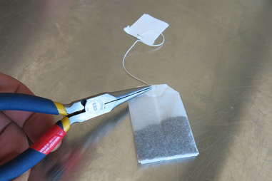 Cutting open a teabag