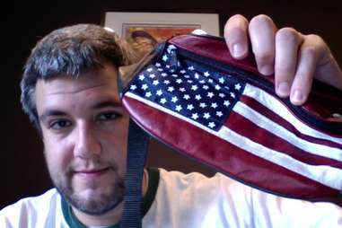 Fanny pack with US flag print held by proud owner