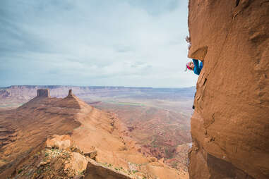 Woman climbing mountain