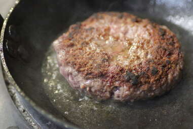 burger in cast iron pan