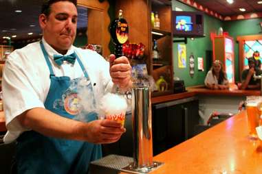 Bartender pouring Flaming Moe at Moe’s Tavern at Universal Studios Orlando