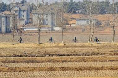 north korean countryside cyclists
