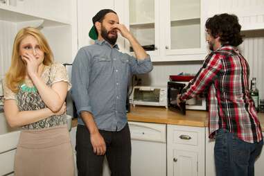 Guy microwaving smelly lunch