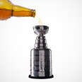 beer being poured into Stanley Cup