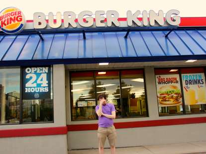 sad man in front of Burger King