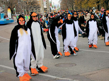 People in penguin costumes