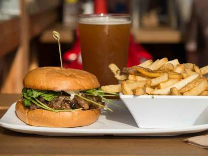 burger and fries and beer at uneeda burger in fremont seattle washington