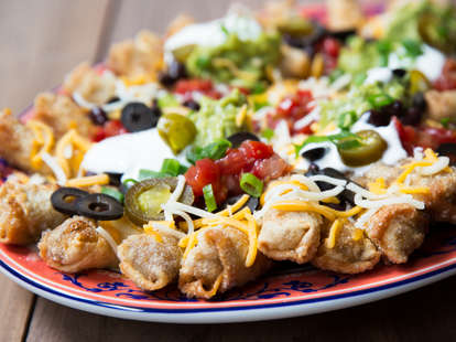 Chimichanga Nachos guarantee each bite has cheese, chiles, and ground beef. — Thrillist Recipes
