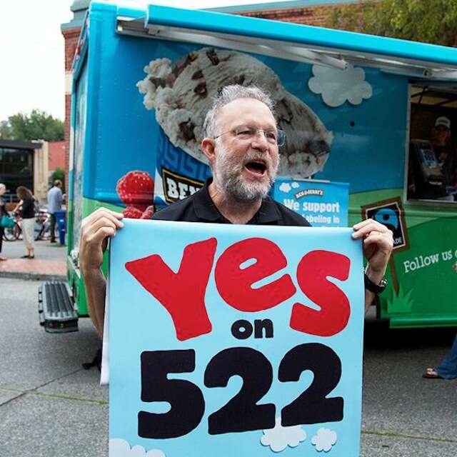 Jerry Greenfield with "Yes on 522" sign