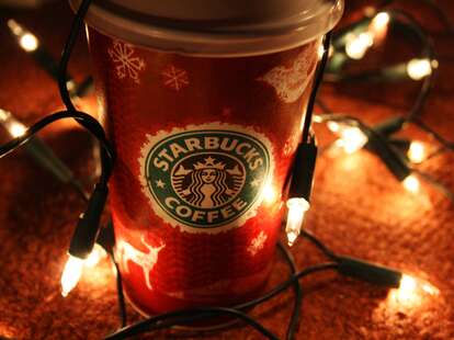 Starbucks red cup with holiday lights