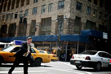 man walking in street in new york city