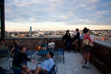 people at a roof top bar
