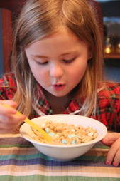 girl eating cereal