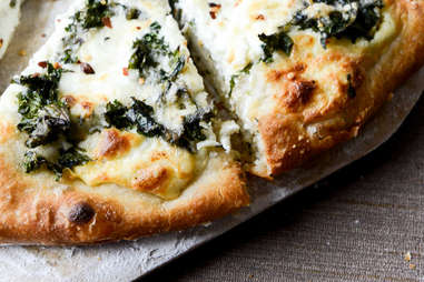 Marinated kale and whipped ricotta pizza