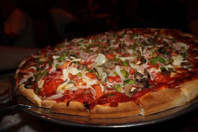 Best Pizza In Michigan Buddy S Rendezvous Jet S Sportsroom B C Pizza Thrillist