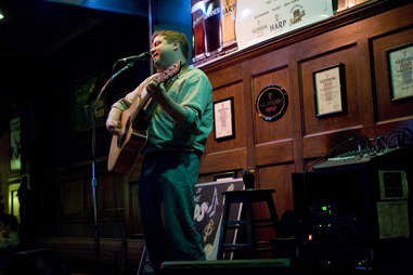 singer playing guitar at Ireland's Four Courts