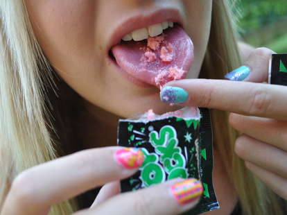 girl eating pop rocks