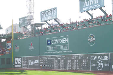 Baseball Fan in Fenway Park Fills in Scorecard