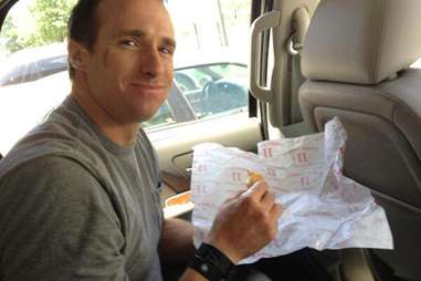 Drew Brees with Jimmy John's sandwich