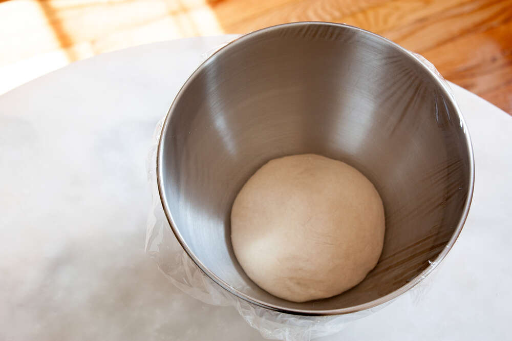 Close Up Of A Baker Kneading Bread Dough In A Metal Mixing Bowl High-Res  Stock Photo - Getty Images