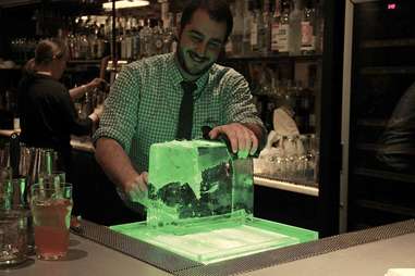 bartender cutting ice