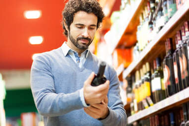 Man buying wine