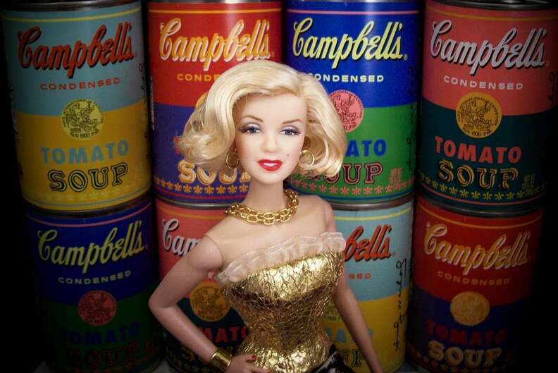 Marilyn Monroe Barbie in front of Warhol Campbell's soup cans