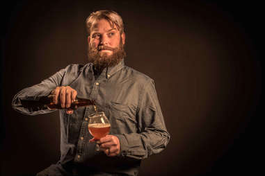 guy pouring beer