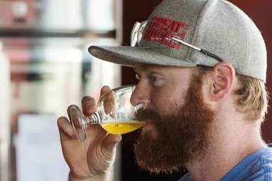 guy drinking Trader Joe's beer