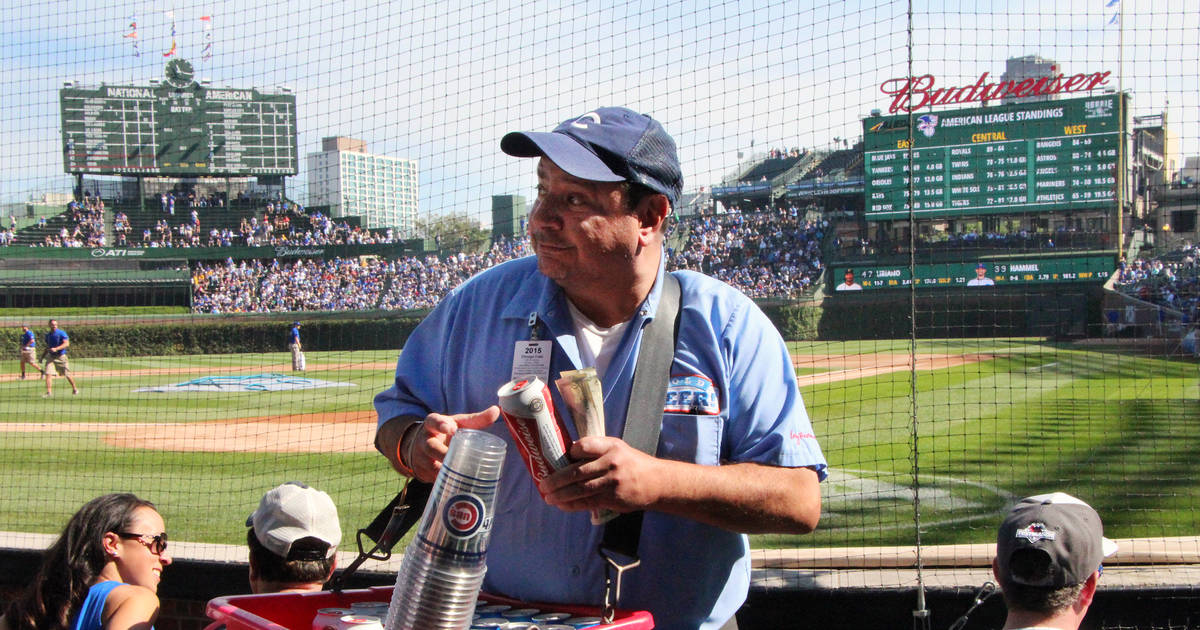 Too cold to hold!, Beer vendor during a baseball game at Bu…