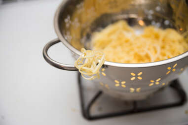 spaghetti in strainer