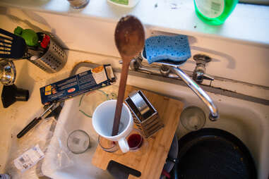 dirty dish tower in sink