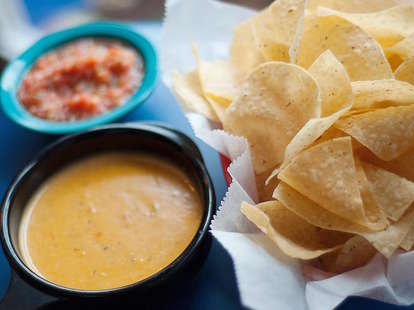 close up of queso, chips and salsa at chuy's in austin